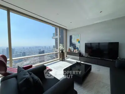 Luxurious living room with panoramic city view, modern furniture, and large windows in high-rise apartment.