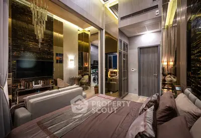 Luxurious bedroom with modern decor and open living area, featuring elegant lighting and stylish furnishings.