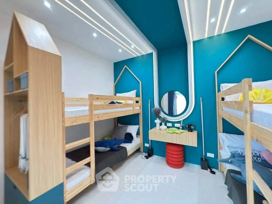 Modern bedroom with bunk beds and stylish decor, perfect for maximizing space and comfort.