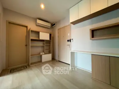 Modern minimalist living room with built-in storage and air conditioning