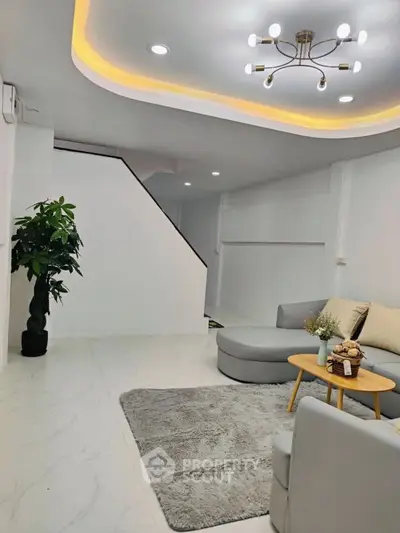 Modern living room with stylish lighting and cozy seating area