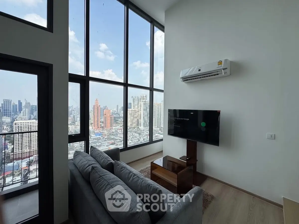 Modern living room with stunning city view and high ceilings