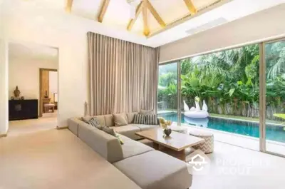 Luxurious living room with pool view and modern decor