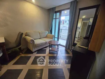 Cozy living room with modern decor and balcony access