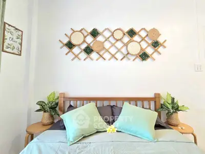Cozy bedroom with stylish decor and comfortable bedding