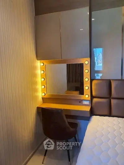 Chic bedroom with illuminated vanity and modern decor