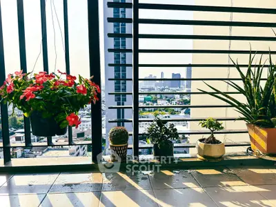 Charming balcony with city view and vibrant potted plants