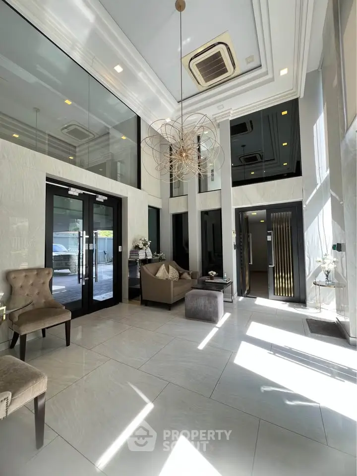 Luxurious building entrance with modern decor and high ceilings