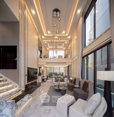 Luxurious modern living room with high ceilings and elegant lighting in a spacious open-plan design.