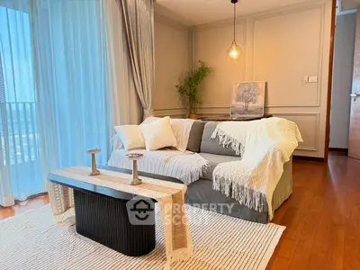 Stylish living room with cozy sofa and elegant decor, perfect for relaxation.