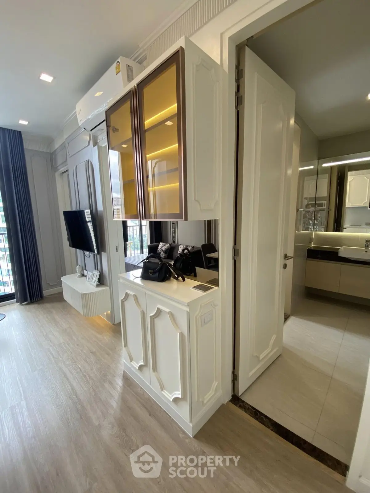 Modern apartment interior with sleek design and open layout, featuring a stylish living area and bathroom.
