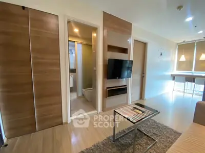 Modern living room with TV and stylish decor in a cozy apartment