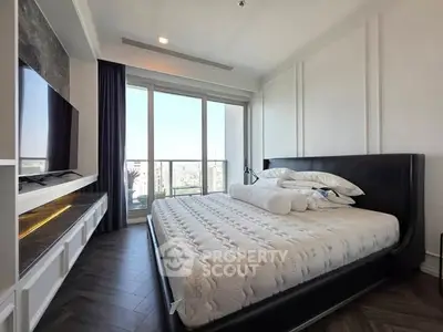 Luxurious bedroom with modern decor and large windows offering stunning city views.