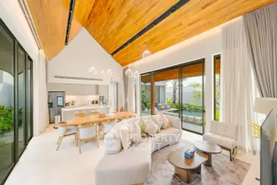 Luxurious open-plan living room with high wooden ceiling and modern decor