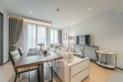 Elegant modern living room with stylish furniture and large windows in a luxury apartment.