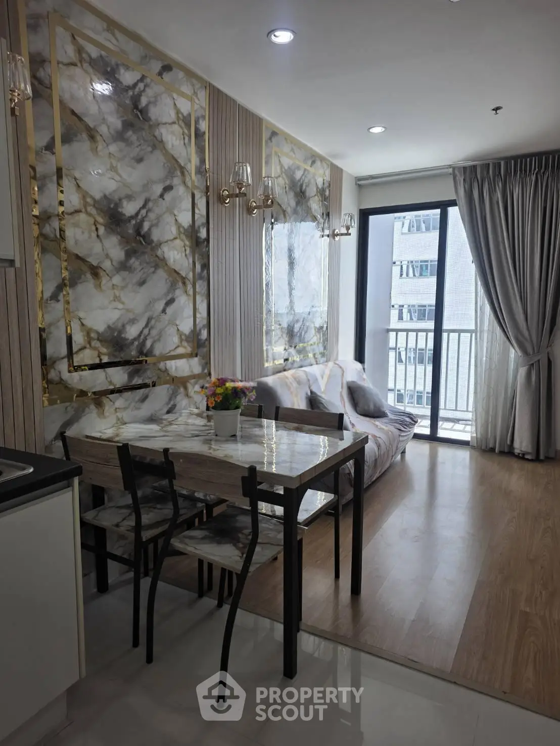 Luxurious modern living room with marble accents and balcony view