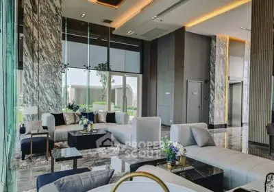 Luxurious modern living room with elegant marble accents and plush seating in a high-end property.