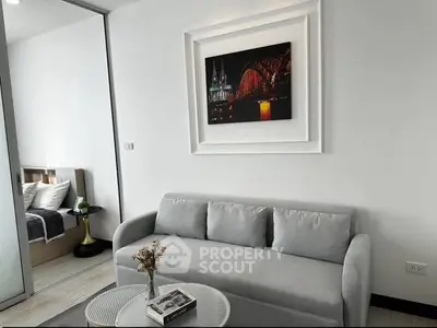 Modern living room with stylish decor and cozy sofa in a contemporary apartment.