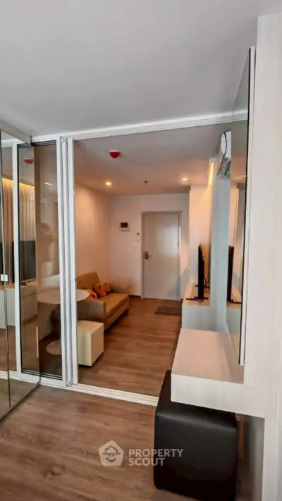 Modern living room with sleek design and cozy ambiance, featuring a comfortable sofa and stylish decor.