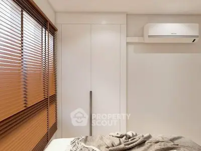 Modern bedroom with sleek closet and air conditioning unit, featuring cozy bedding and stylish window blinds.