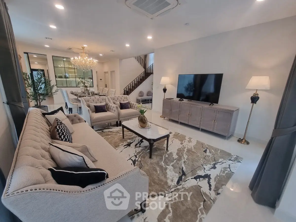 Luxurious open-plan living room with elegant decor and modern furnishings