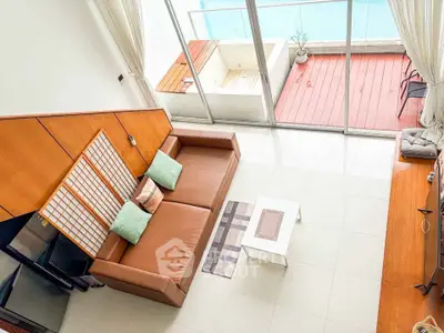 Spacious living room with pool view and modern decor