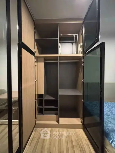 Spacious modern wardrobe with sleek design in a stylish bedroom setting.