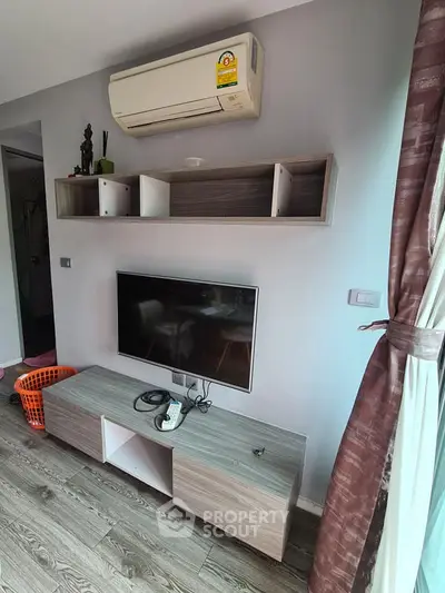Modern living room with air conditioning and stylish TV setup