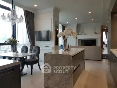 Luxurious open-plan living room with elegant dining area and modern kitchen island.