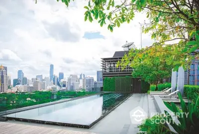 Luxurious rooftop pool with stunning city skyline view and lush greenery