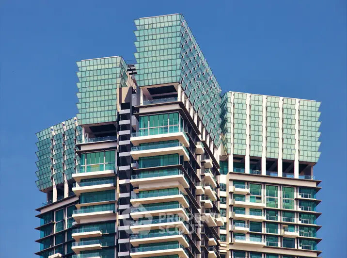 Stunning modern high-rise building with unique architectural design and glass facade.