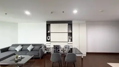 Modern living room with sleek furniture and elegant decor in a stylish apartment.