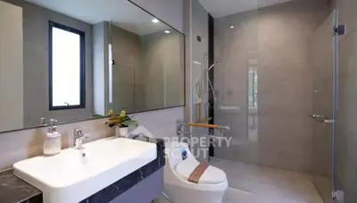 Modern bathroom with sleek design and spacious shower area