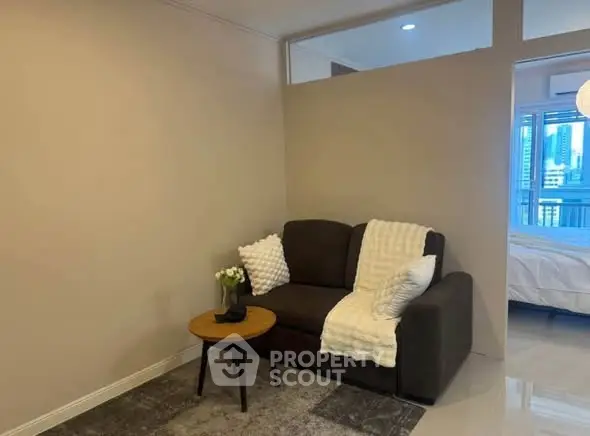 Cozy living room with modern sofa and city view in background