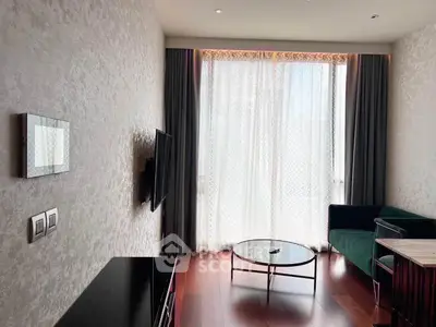 Modern living room with elegant decor, featuring a wall-mounted TV, stylish furniture, and floor-to-ceiling windows.