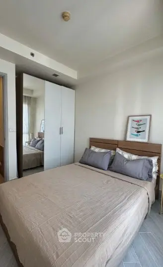 Cozy bedroom with modern decor and ample natural light