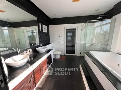 Luxurious modern bathroom with dual sinks and spacious bathtub