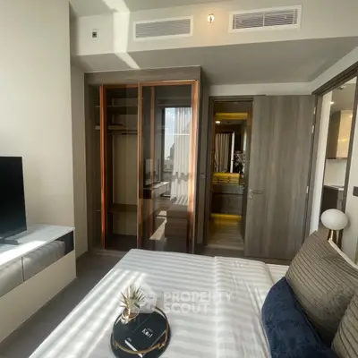 Modern bedroom with open closet and stylish decor in a luxury apartment