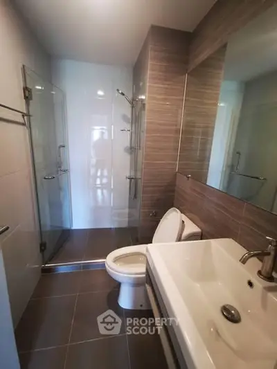 Modern bathroom with glass shower and sleek fixtures