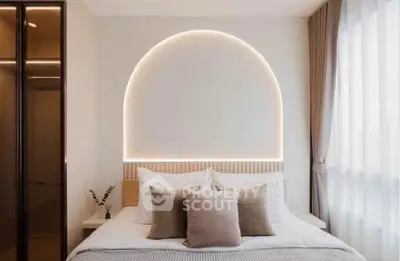 Elegant bedroom with modern lighting and cozy decor