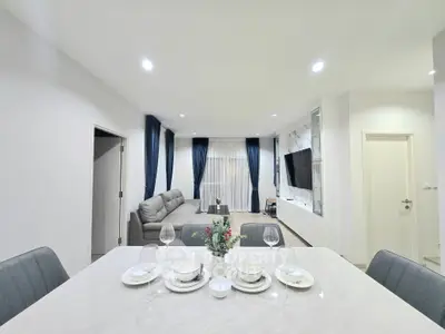 Modern living room with elegant dining area and stylish decor