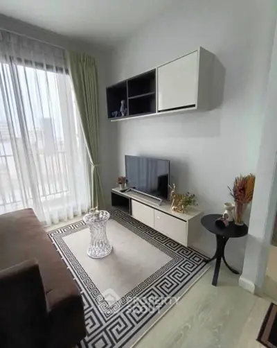 Modern living room with stylish decor and large window view