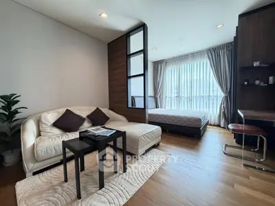 Modern studio apartment with cozy living area and stylish decor