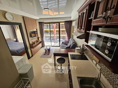 Modern studio apartment with open kitchen and cozy living area