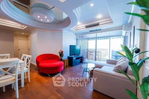 Spacious living room with modern decor and balcony view