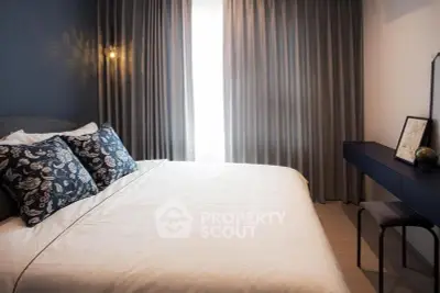 Elegant bedroom with stylish decor and natural light