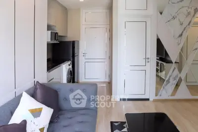 Modern living room with stylish decor and integrated kitchen appliances