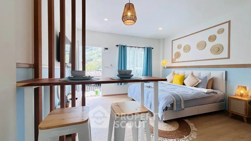 Charming bedroom with modern decor and mountain view, featuring cozy bed and stylish lighting.