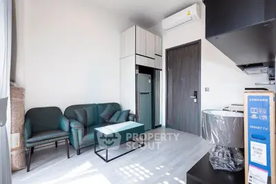 Modern living room with sleek furniture and air conditioning in a stylish apartment.