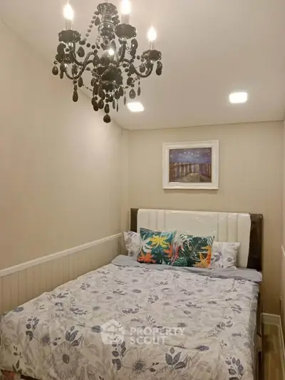 Cozy bedroom with elegant chandelier and floral bedding
